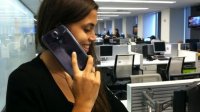 FoxNews.com editor Stephanie McNeal attempts to talk on the giganitc Samsung Galaxy Mega, a new smartphone with a 6.3-inch screen.